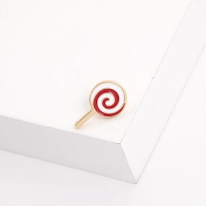 Detailed close-up of a red and white spiral lollipop enamel brooch with gold metallic edges
