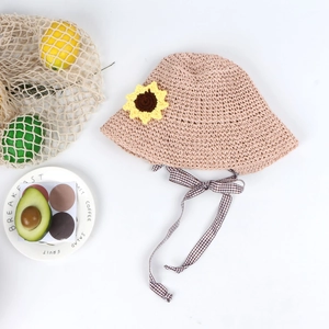 Pink straw sun hat for girls with sunflower detail and checkered ribbon tie strap