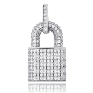 Macro shot of silver hip hop lock pendant fully set with sparkling cubic zirconia stones