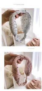 Close-up of knit lace headbands with hollow mesh patterns in beige and light pink