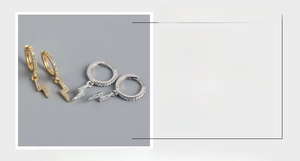 Detail view of lightning bolt earrings in S925 silver with gold and silver plating