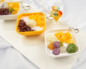 Detailed close-up of PVC dessert charms featuring mango, red beans and taro balls