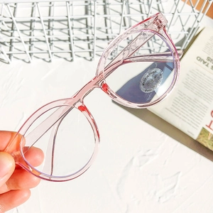Kids round anti-blue light glasses in transparent pink frame with UV400 protection