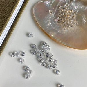 Detailed macro view of 925 silver butterfly earring backs with protective silicone casing