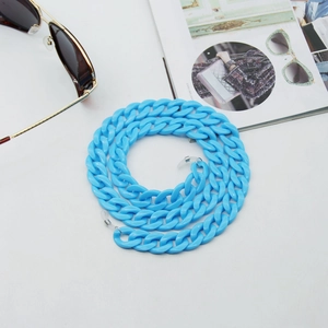 Macro detail of sky blue chunky acrylic glasses chain with white silicone loops