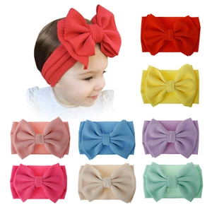 Extra large bow baby headband in multi-color waffle knit fabric for newborns and toddlers