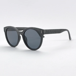 Classic black D-frame sunglasses with embossed geometric patterns on temples and dark lenses