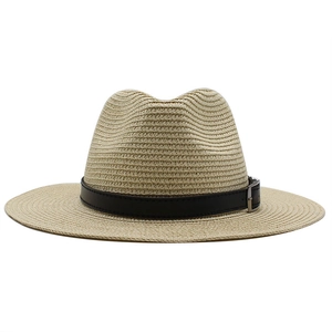 Close-up of Panama straw fedora hat featuring a black leather band and silver metal buckle