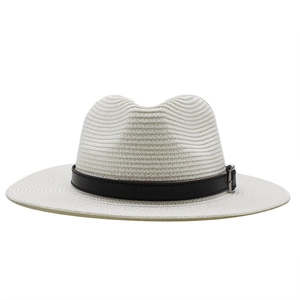 Detailed texture of ivory Panama straw hat featuring a black leather band and silver buckle