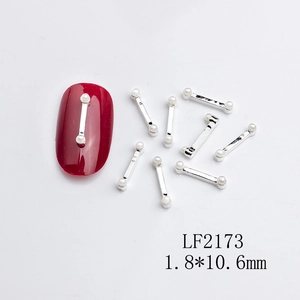 Detailed view of silver metal nail art strips with white pearls and 1.8x10.6mm dimensions