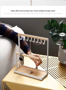 White iron jewelry stand with wood organizer, hooks for necklaces and rings tray