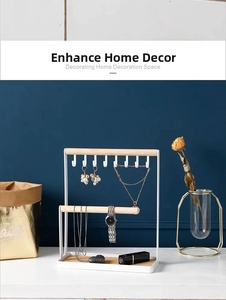 Modern white metal jewelry stand with wooden hooks and base for earrings and necklaces
