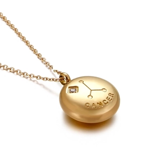Minimalist gold Cancer zodiac necklace with matte pendant and sparkling crystal stone