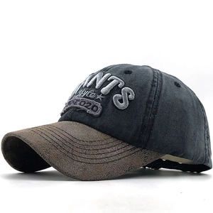 Washed grey cotton baseball cap with ANTS embroidery and brown leather-texture brim