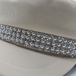 Beige Newsboy Cap with pearl and rhinestone trim, featuring premium woven texture