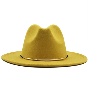 Close-up of yellow wool fedora hat featuring a stylish gold metal ring buckle detail