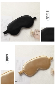 Detail of silk-like sleeping masks in black and gold showing smooth texture and elastic strap