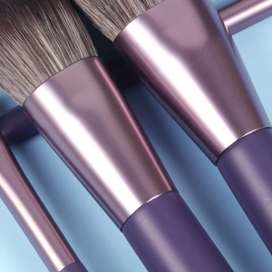 Close-up of purple metallic handle and soft gradient bristles of the mini makeup brush set