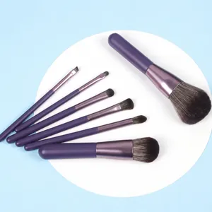 Detailed top view of 7 pieces mini makeup brush set with purple matte handles and soft fibers