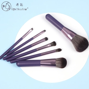 Detailed top view of 7 pieces mini makeup brush set with purple matte handles and soft fibers