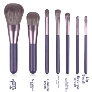 Detailed set of 7 portable makeup brushes with purple handles and synthetic gradient bristles
