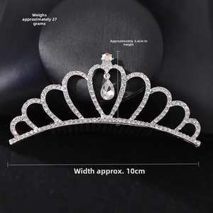 Detail view of silver crystal crown hair comb with 10cm width and heart shape design