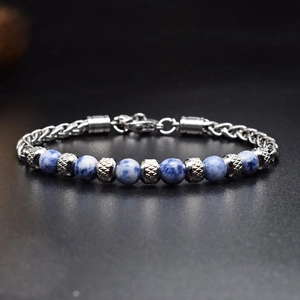 Macro shot of 6mm blue stone beads and textured silver metal chain with lobster clasp