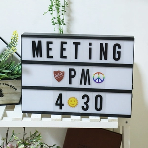 A4 Cinema Light Box with black frame and 3 rows for letters on a wooden shelf