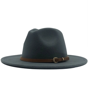 Detail of dark grey wool felt fedora hat featuring a brown leather band with gold buckle
