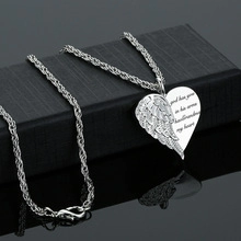 Silver necklace with wing heart pendant engraved God has you in his arms on black box