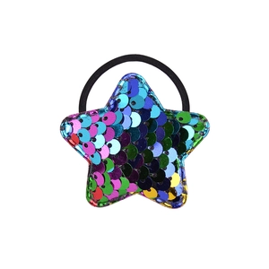 Close-up of glittery pentagram hair tie with colorful sequins and elastic black rope