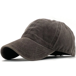 Detailed close-up of dark grey washed cotton baseball cap with vintage distressed texture