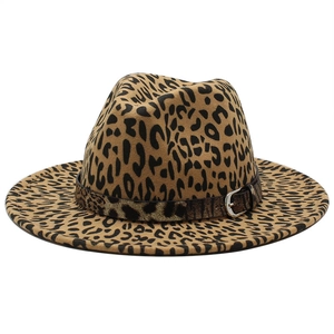 Detail of leopard print fedora hat featuring a stylish dark band with a metal buckle