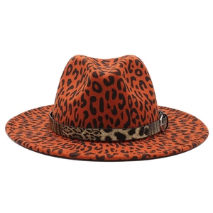 Detail shot of leopard print wool felt fedora featuring a decorative band and metal buckle