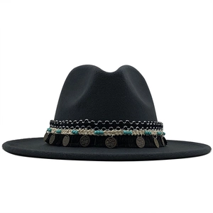 Detail of wool fedora hat with ethnic band, turquoise beads, and bronze charms