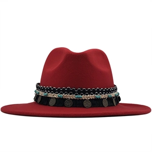 Detail of dark red wool fedora featuring ethnic braided band, beads and bronze coins