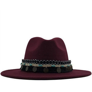 Ethnic style wool fedora hat in burgundy featuring a wide brim and bohemian tassel band