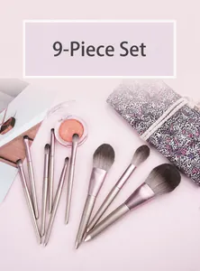 Detailed 9-piece champagne pink makeup brush set with floral pouch and powder compact