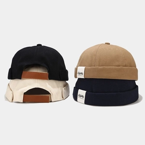 Classic cotton miki hats in four colors with leather adjustable straps and side labels