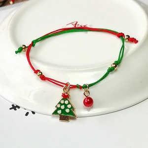 Braided Christmas bracelet with green Christmas tree charm and red beads for festive gifts
