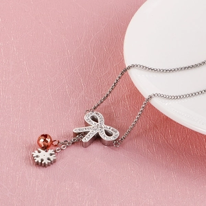 Adjustable titanium steel butterfly bracelet with crystal accents and gold bell charm