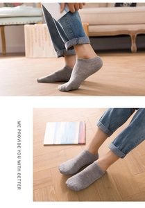 Detail of gray low-cut invisible socks featuring a ribbed cuff and soft knit material