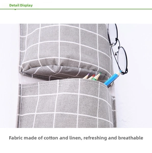 Detail view of cotton linen plaid hanging organizer showing storage of glasses and pencils