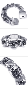 Detail of Gothic skull links on vintage silver stainless steel punk bracelet for men