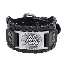 Detail of Viking wide leather bracelet with silver Valknut symbol and Runes engraving