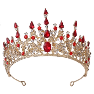 Detailed view of Baroque bridal tiara with red rhinestones and gold alloy frame