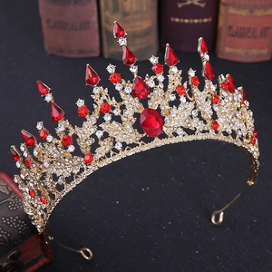 Vintage baroque bridal crown with red gemstones and crystals on a gold alloy base