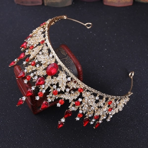 Detail of baroque bridal crown with red teardrop crystals and gold alloy base