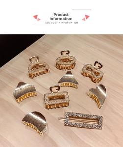 Detailed close-up of gold geometric hair clips and heart claws with textured metal finish
