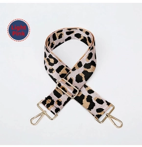 Detail of adjustable leopard print bag strap in light pink with gold hardware hooks